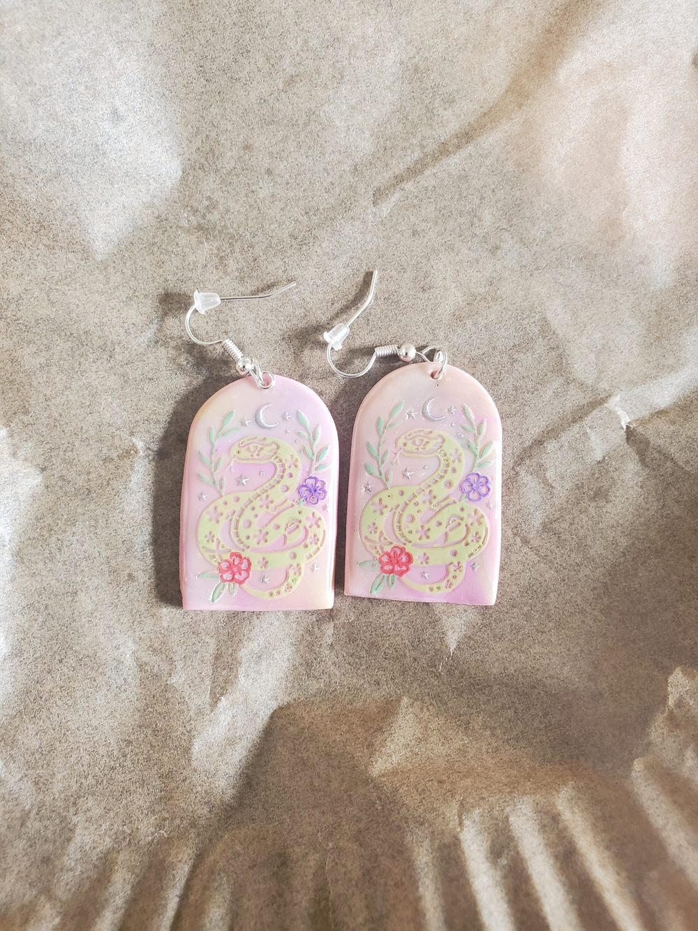 Charming dangle earrings featuring whimsical Snakes